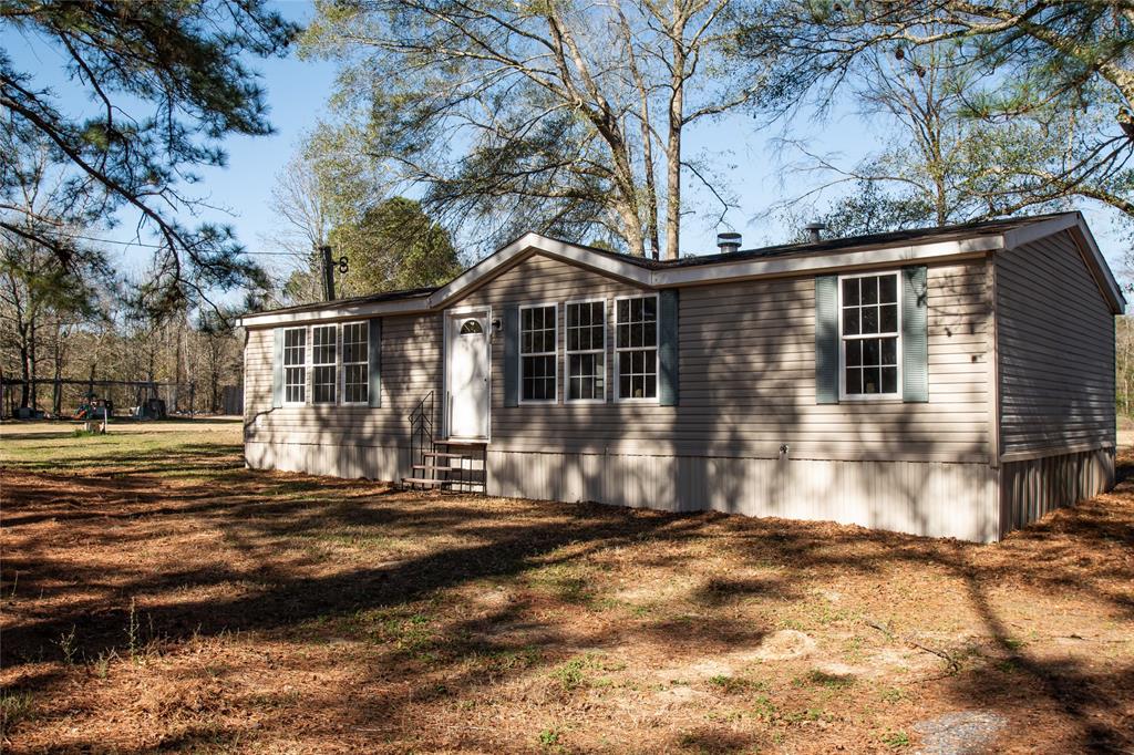 128 Fob Lane Frierson, LA 71027 - Photo 22 of 22 a front view of a house with a yard
