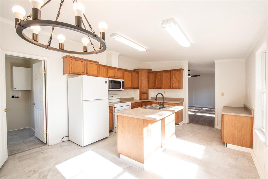 128 Fob Lane Frierson, LA 71027 - Photo 8 of 22 a kitchen with a cabinets and refrigerator