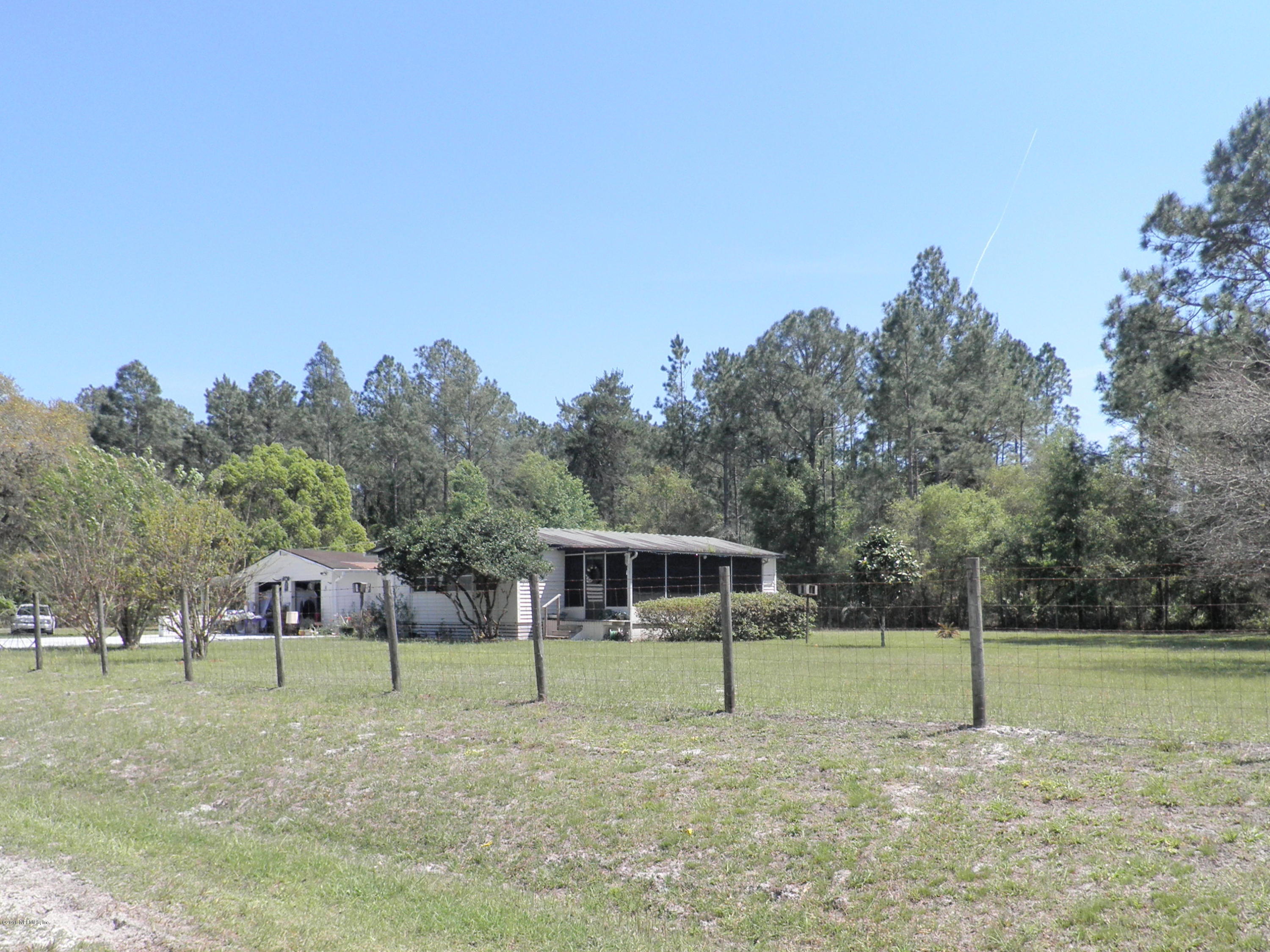 124 Whispering Pines Road Georgetown, FL 32139 - Photo 1 of 1 a house view with a garden space