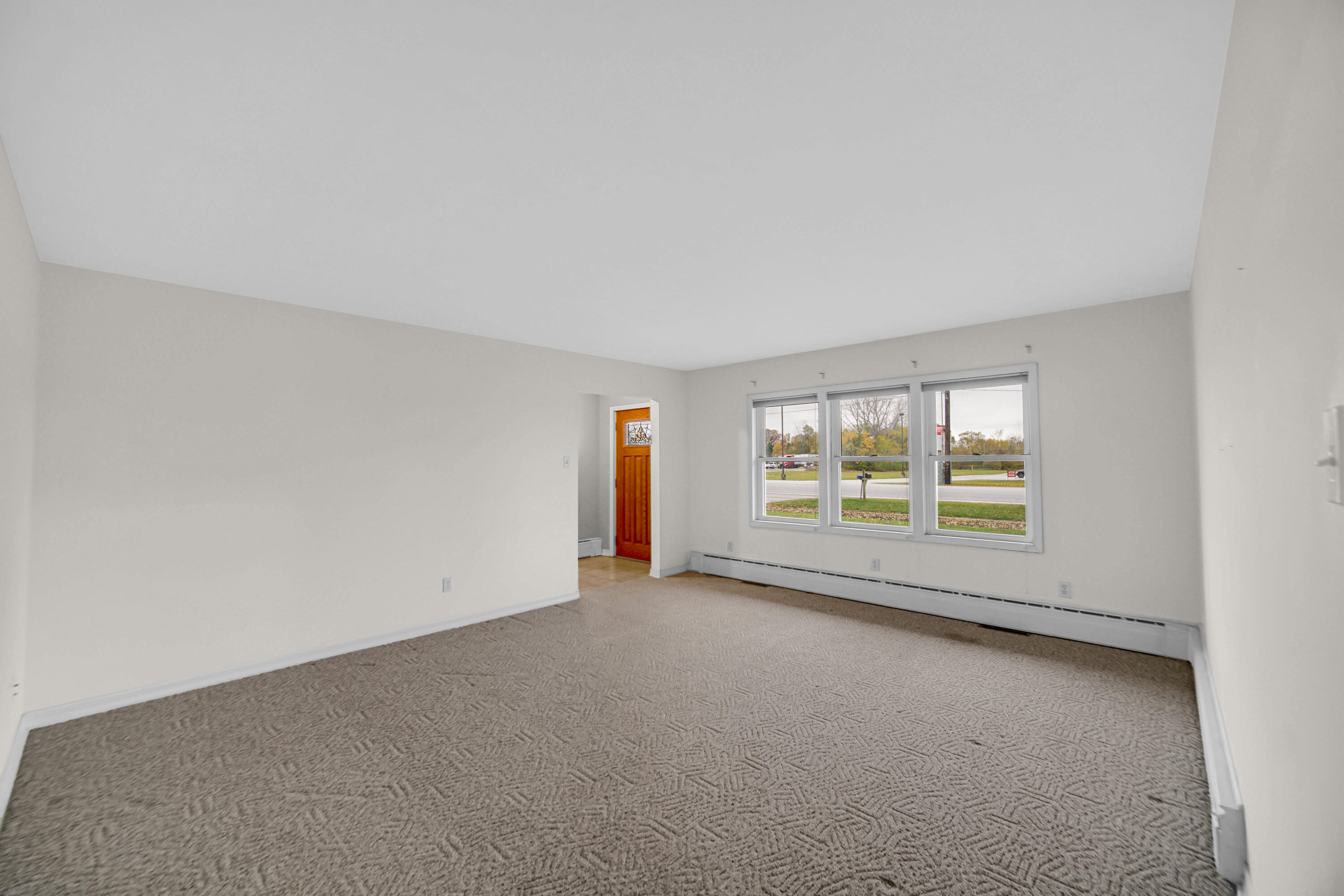 204 North Main Street Kouts, IN 46347 - Photo 16 of 28 an empty room with large windows