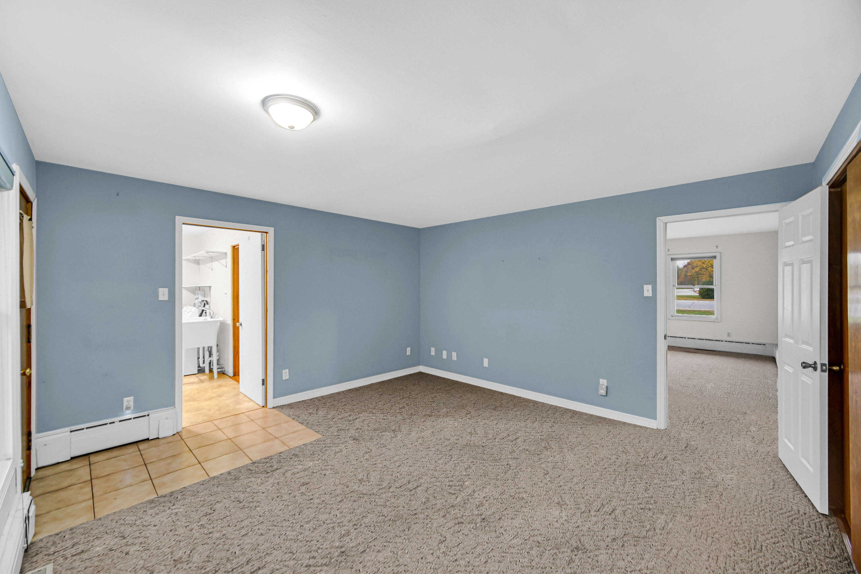 204 North Main Street Kouts, IN 46347 - Photo 19 of 28 an empty room with windows and closet