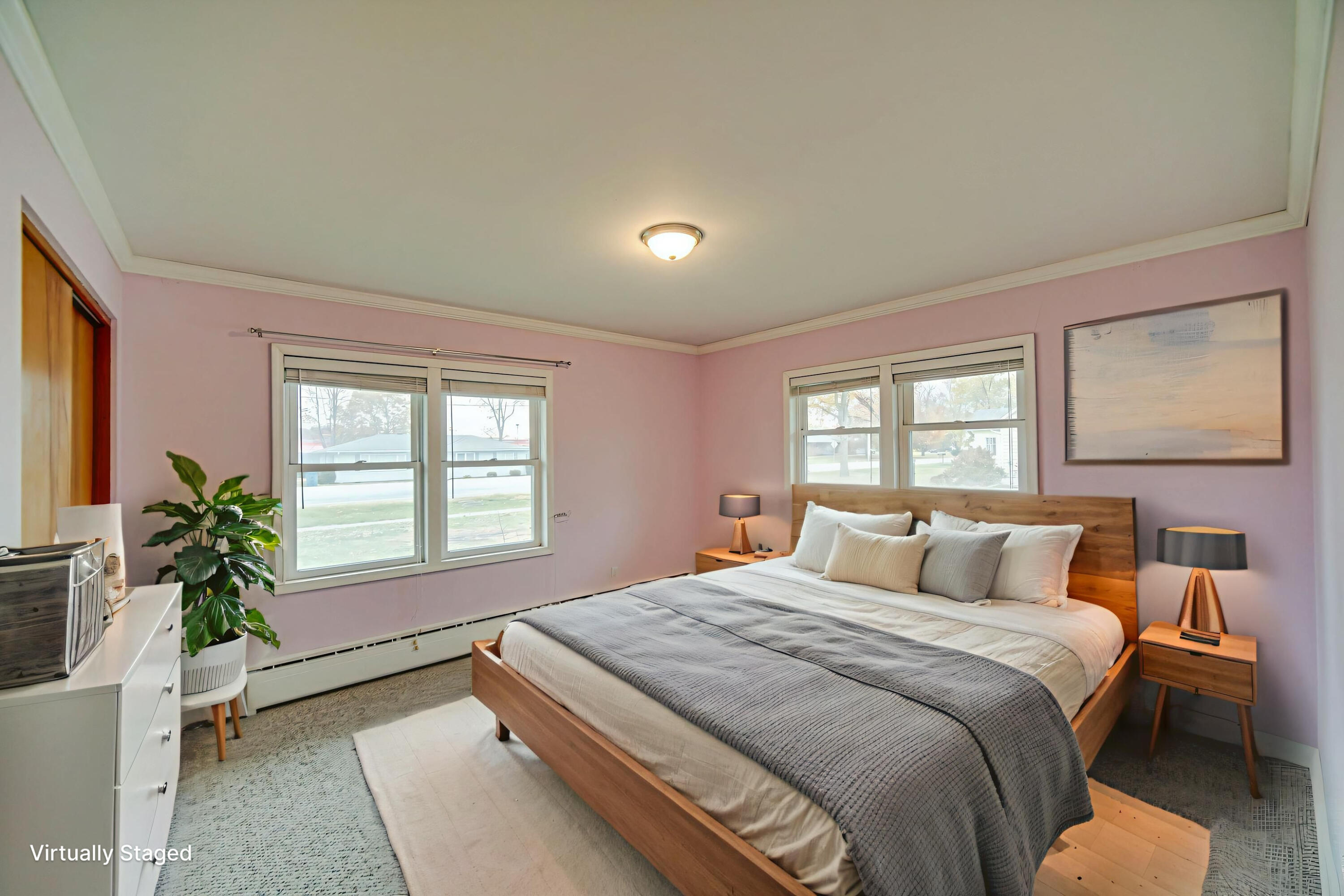 204 North Main Street Kouts, IN 46347 - Photo 6 of 28 a bedroom with a large bed and a potted plant
