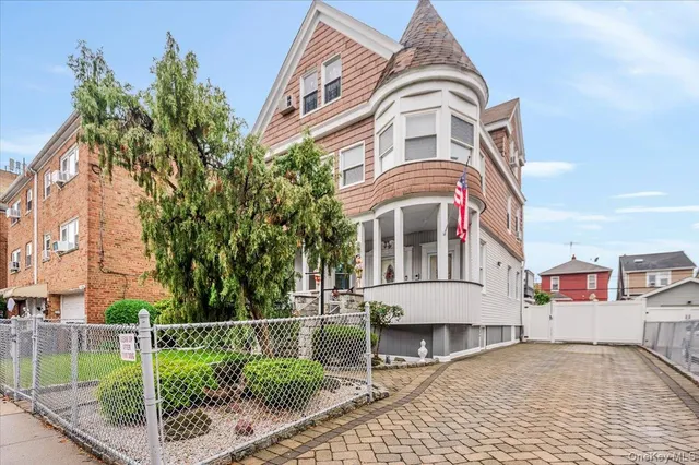 a front view of a residential houses with yard