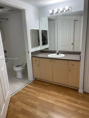 a bathroom with a sink and a toilet