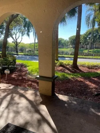 a view of a yard with swimming pool