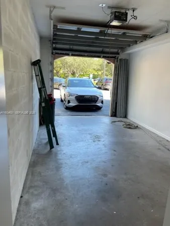 a view of room with window and furniture