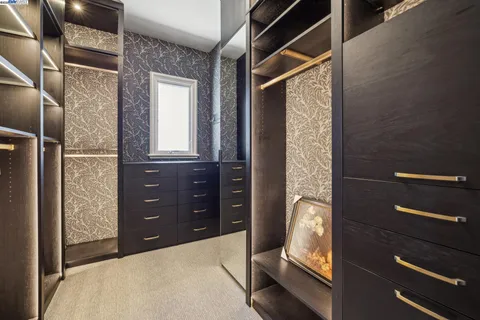 a view of a livingroom with furniture and a window