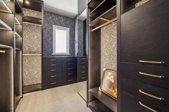 a view of a livingroom with furniture and a window