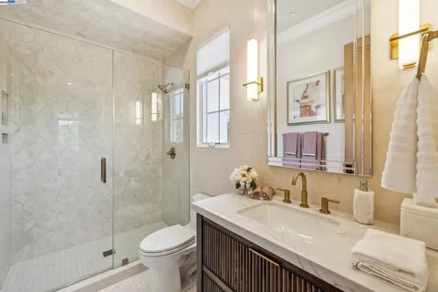 a living room with furniture a table and a large window