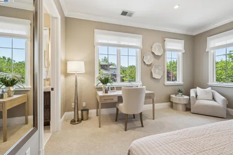 a bathroom with a sink toilet a mirror and shower