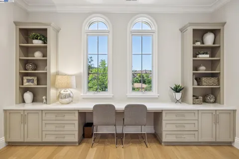 a bedroom with a bed and a table in it