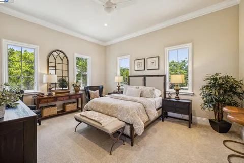 a bathroom with a granite countertop sink mirror toilet and shower