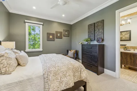 a view of swimming pool with seating area and garden view