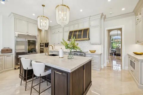 a kitchen with a table and chairs in it