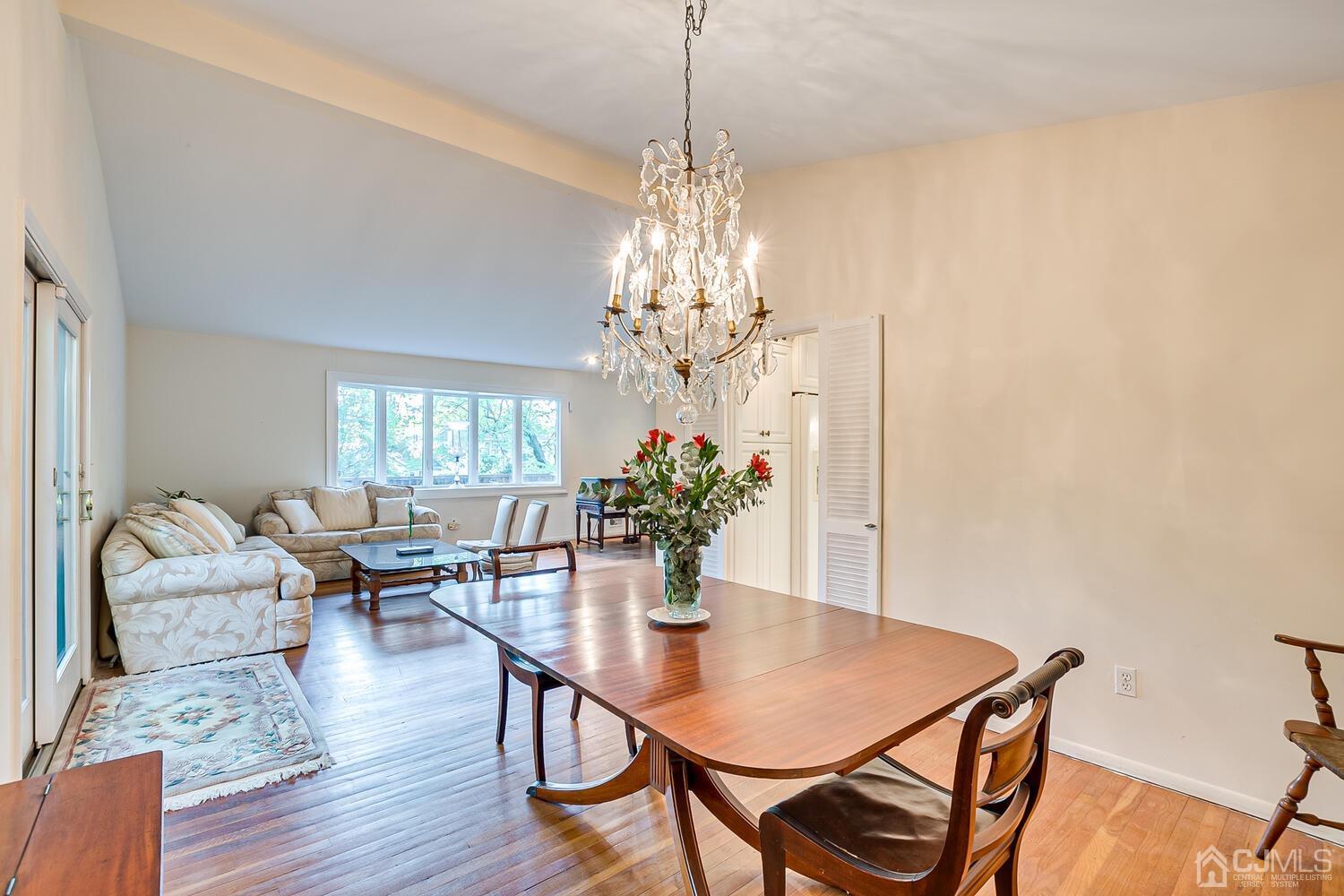 16 Bradford Road Edison, NJ 08820 - Photo 14 of 39 a dining room with furniture potted plants and wooden floor