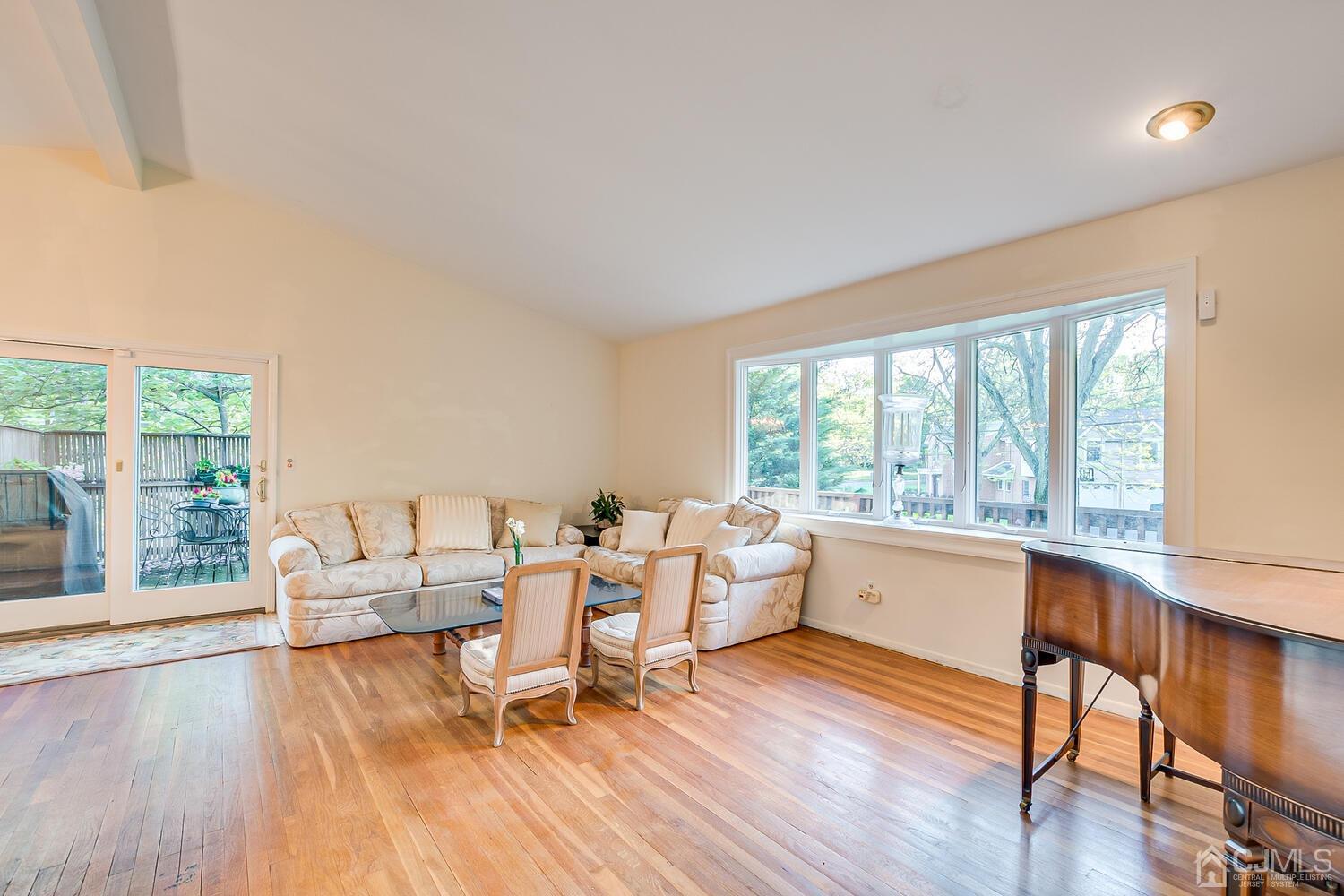 16 Bradford Road Edison, NJ 08820 - Photo 8 of 39 a living room with furniture and floor to ceiling windows