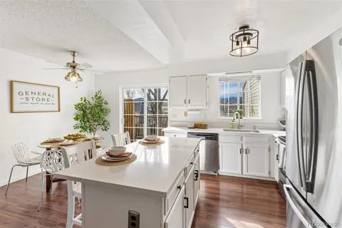 a kitchen with center island and stainless steel appliances