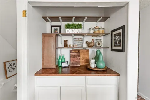 a kitchen with a sink and potted plant