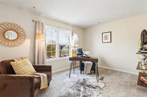 a work room with furniture and a window