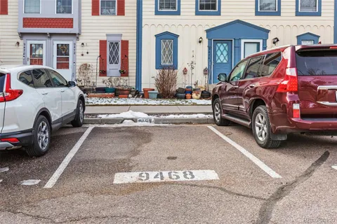 a view of a cars park in front of a house