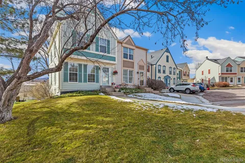 a swimming pool with outdoor seating and yard