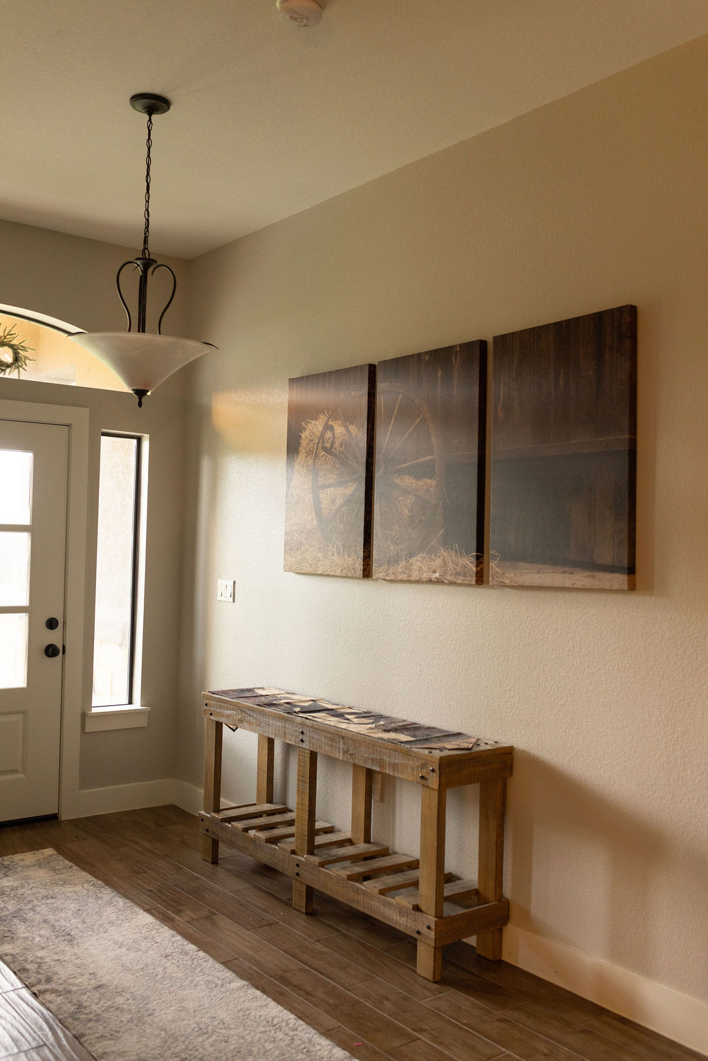 111 Powder Ridge Luling, TX 78648 - Photo 12 of 22 A well-lit entry hall features rich wood flooring and a classic pendant light fixture.