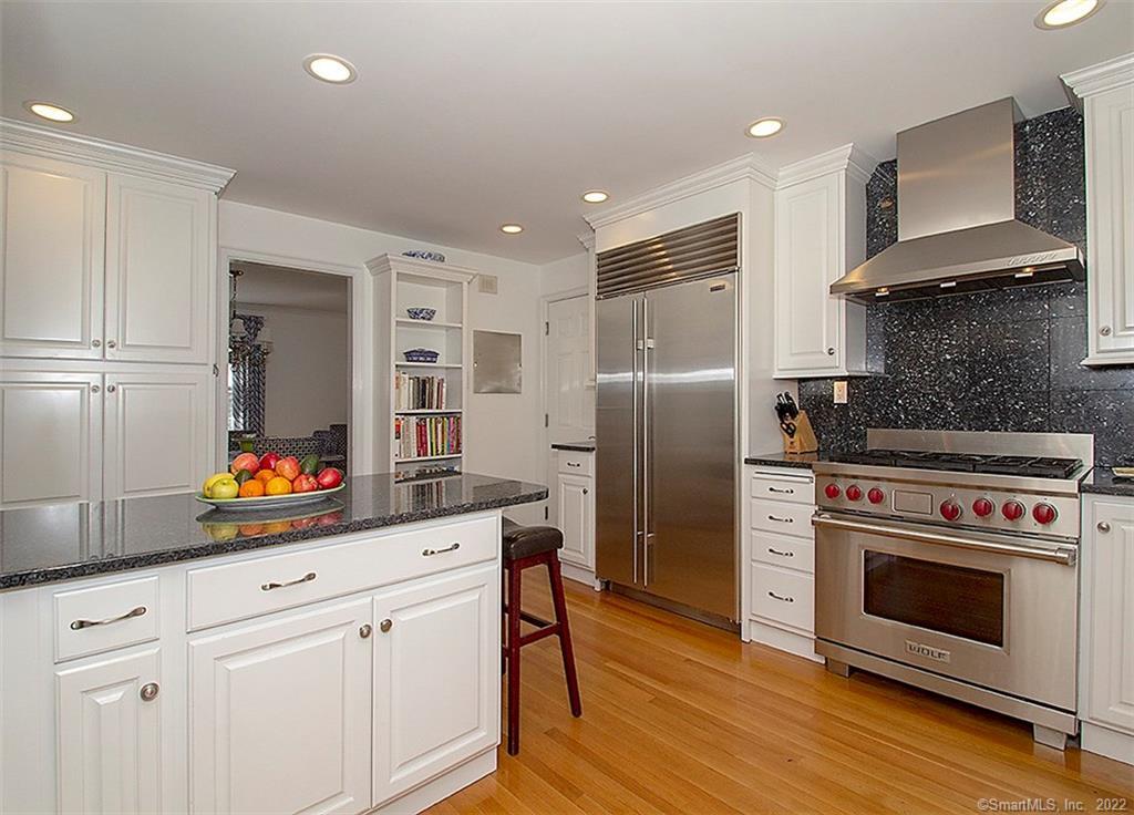 1087 Racebrook Road Woodbridge, CT 06525 - Photo 1 of 1 a kitchen with stainless steel appliances a stove microwave and refrigerator