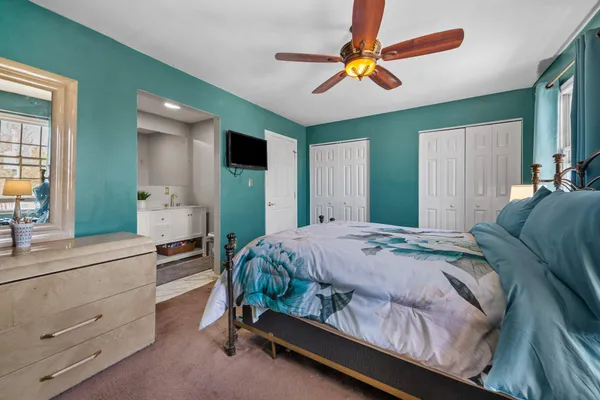 a bed room with a bed and a dresser