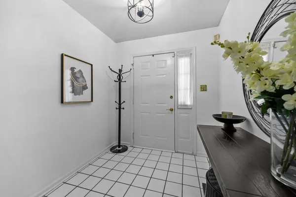 a view of a hallway with seating area