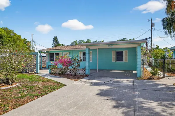 a view of a house with yard porch and sitting area