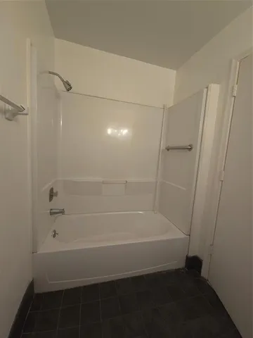 a bathroom with a toilet a sink and a mirror