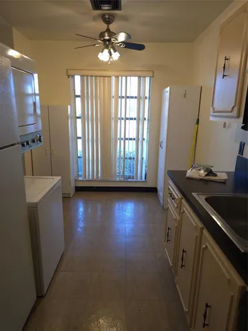 a view of a livingroom with furniture and a window