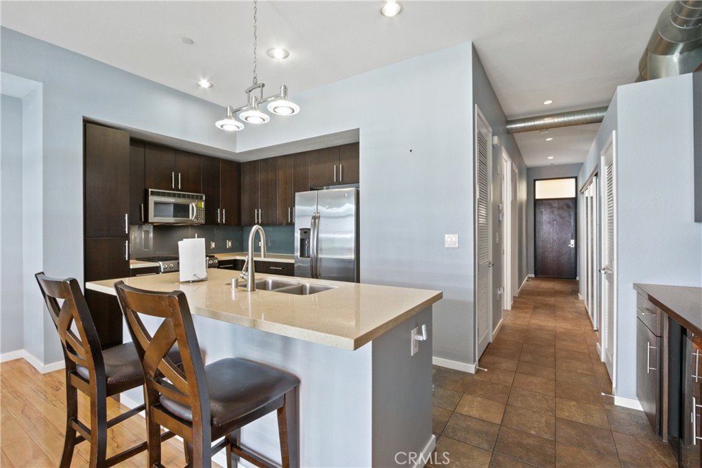 133 The Promenade North, Unit 330 Long Beach, CA 90802 - Photo 1 of 17 a view of a dining room with furniture