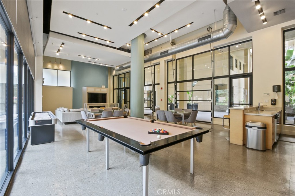 133 The Promenade North, Unit 330 Long Beach, CA 90802 - Photo 15 of 17 a living room with furniture a large window and a table