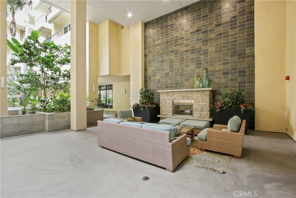 133 The Promenade North, Unit 330 Long Beach, CA 90802 - Photo 16 of 17 a living room with furniture and a fireplace