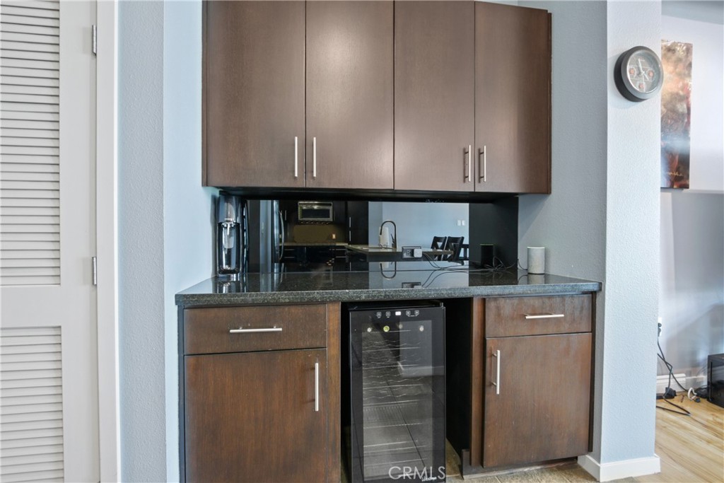 133 The Promenade North, Unit 330 Long Beach, CA 90802 - Photo 6 of 17 a kitchen with granite countertop a cabinets and a stove top oven