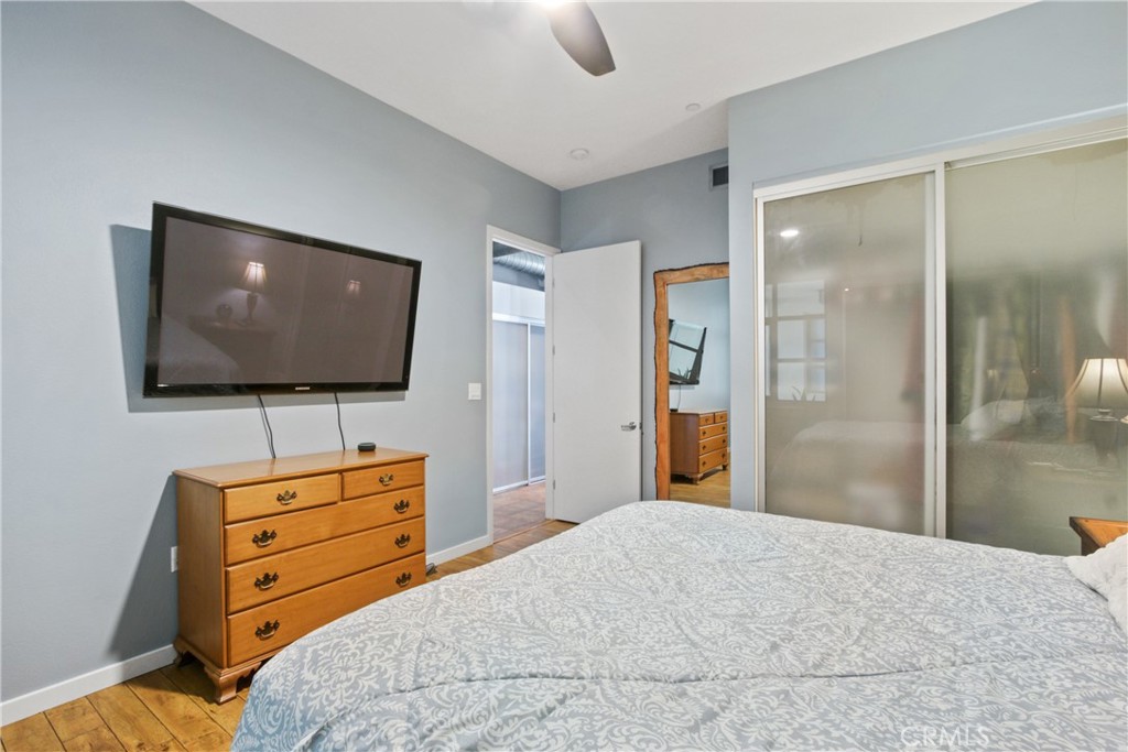 133 The Promenade North, Unit 330 Long Beach, CA 90802 - Photo 9 of 17 a bedroom with a bed and flat screen tv