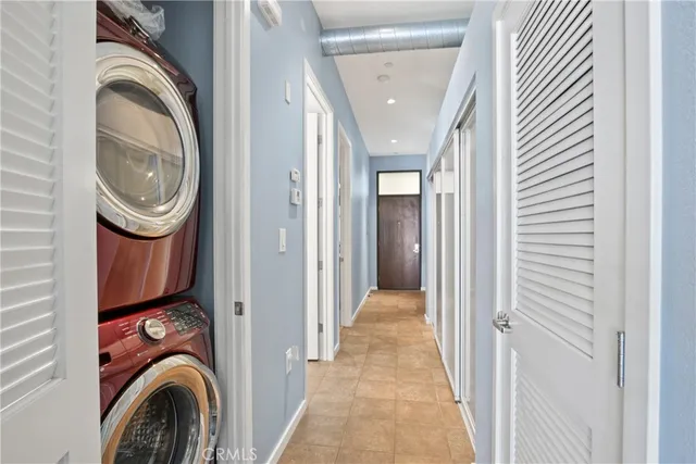 a view of a hallway with washer and dryer