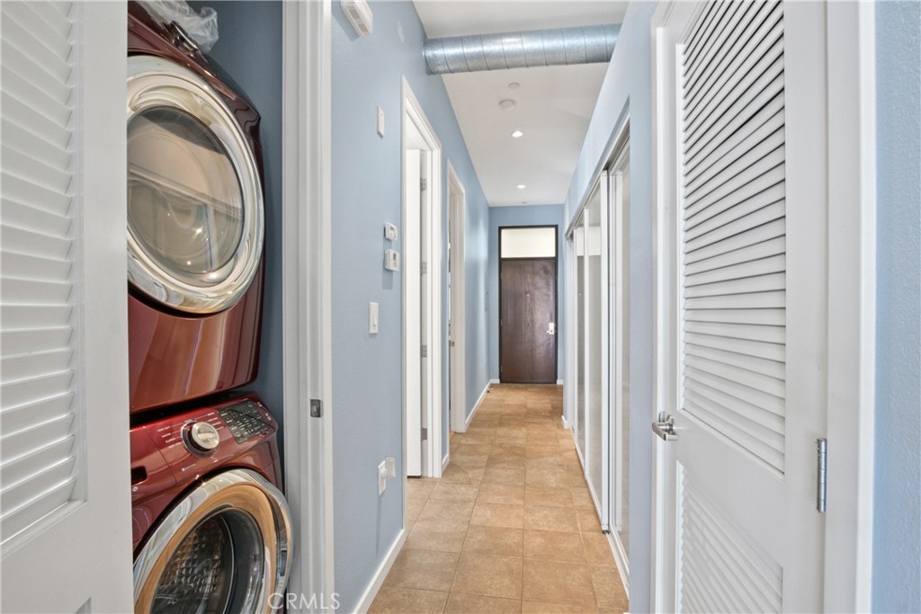 133 The Promenade North, Unit 330 Long Beach, CA 90802 - Photo 10 of 17 a view of a hallway with washer and dryer