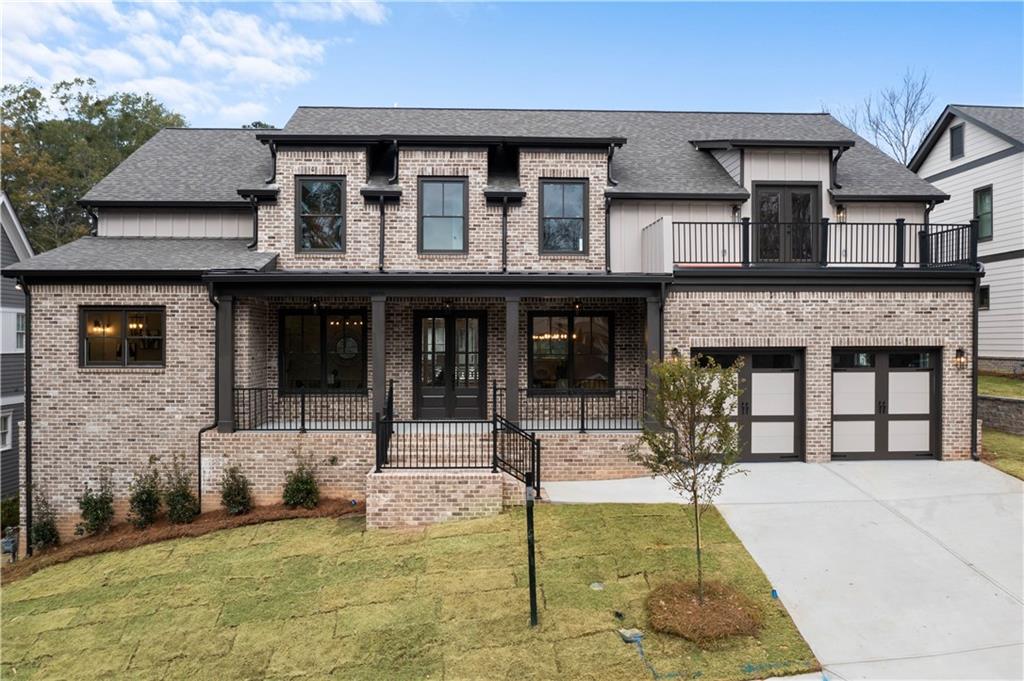 299 Ruth Street Northwest Norcross, GA 30071 - Photo 1 of 1 a view of a brick house with large windows and plants