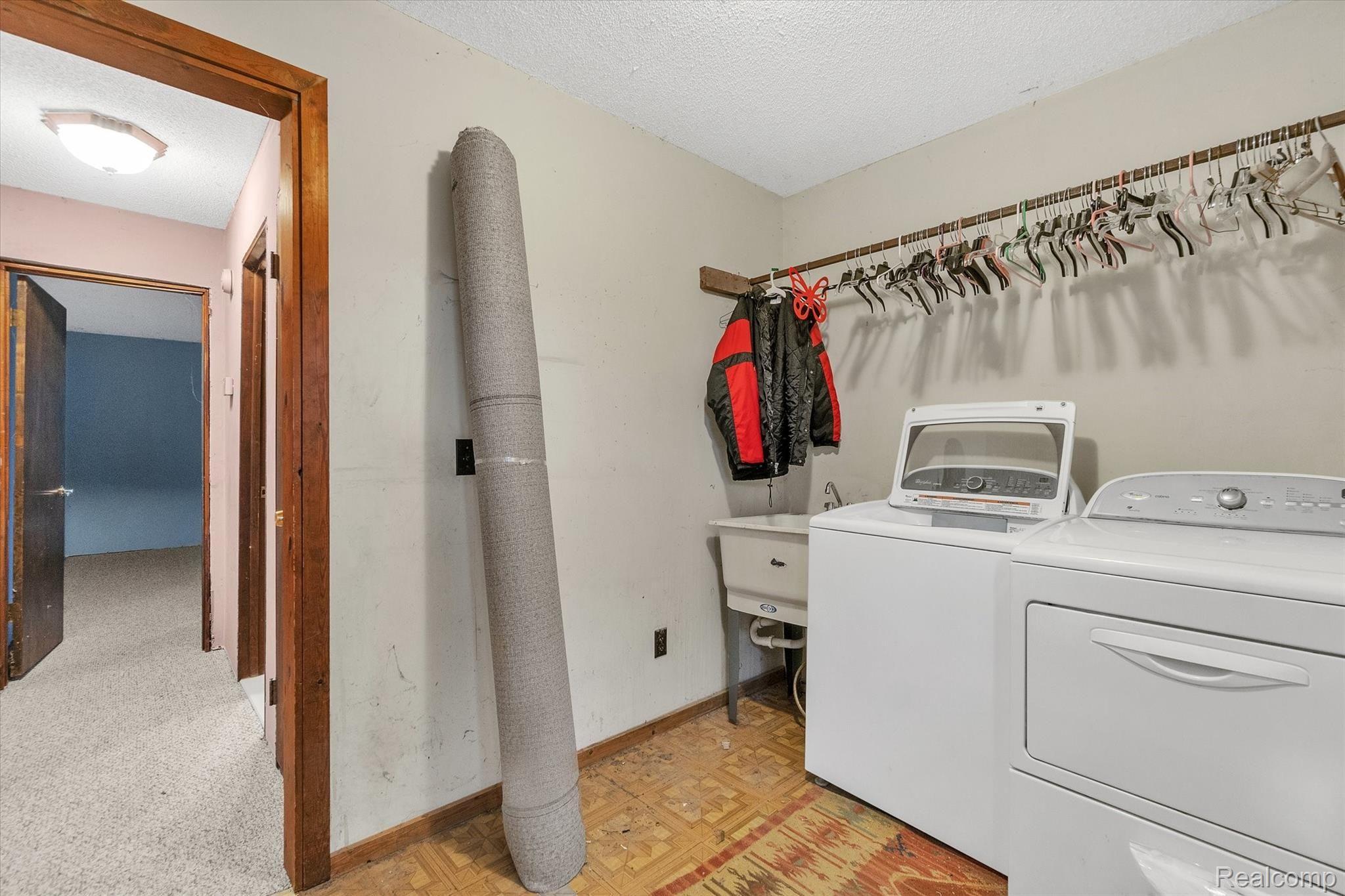 5349 Faussett Road Howell, MI 48855 - Photo 10 of 31 First floor laundry is immediately upon entrance into the house.