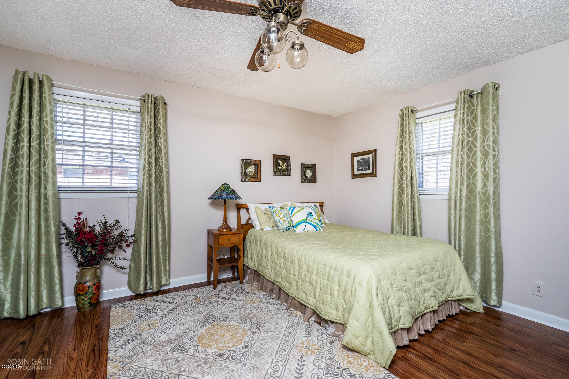 5720 School Road Macon, GA 31216 - Photo 18 of 31 a bedroom with a bed and a chandelier