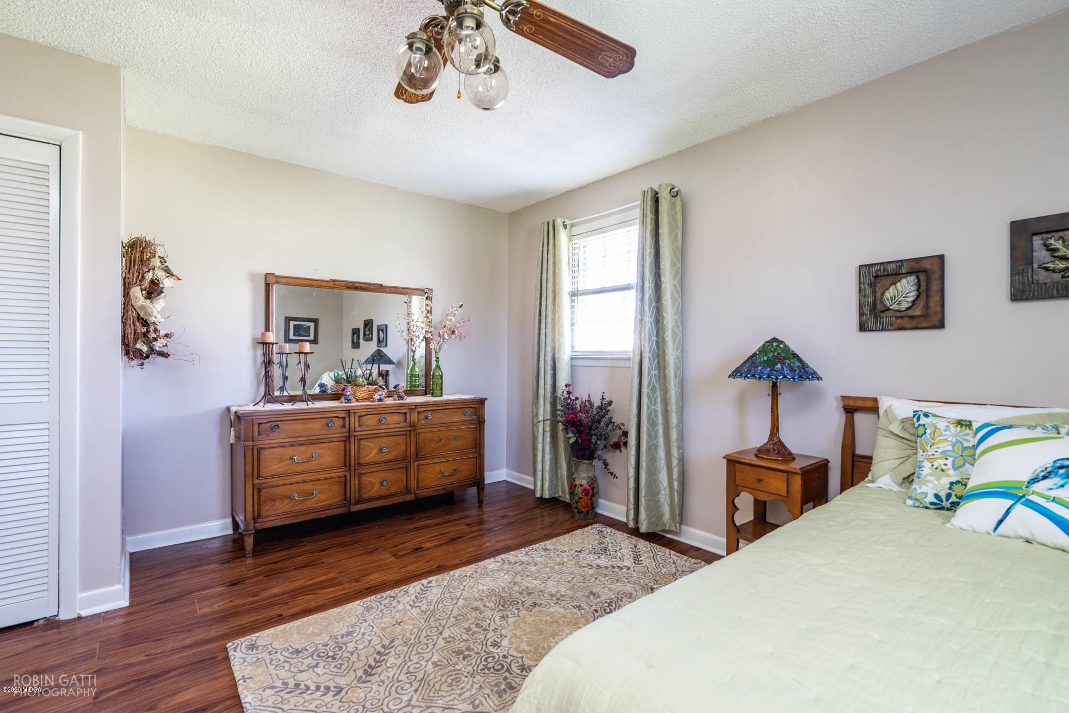 5720 School Road Macon, GA 31216 - Photo 19 of 31 a bedroom with a bed and a chandelier