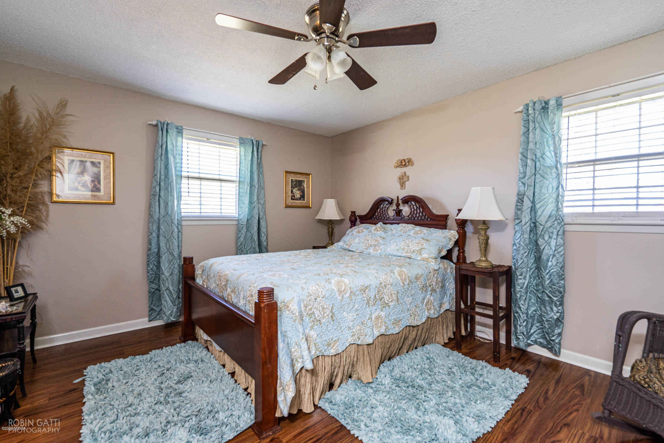 5720 School Road Macon, GA 31216 - Photo 21 of 31 a bedroom with a bed chandelier and a window