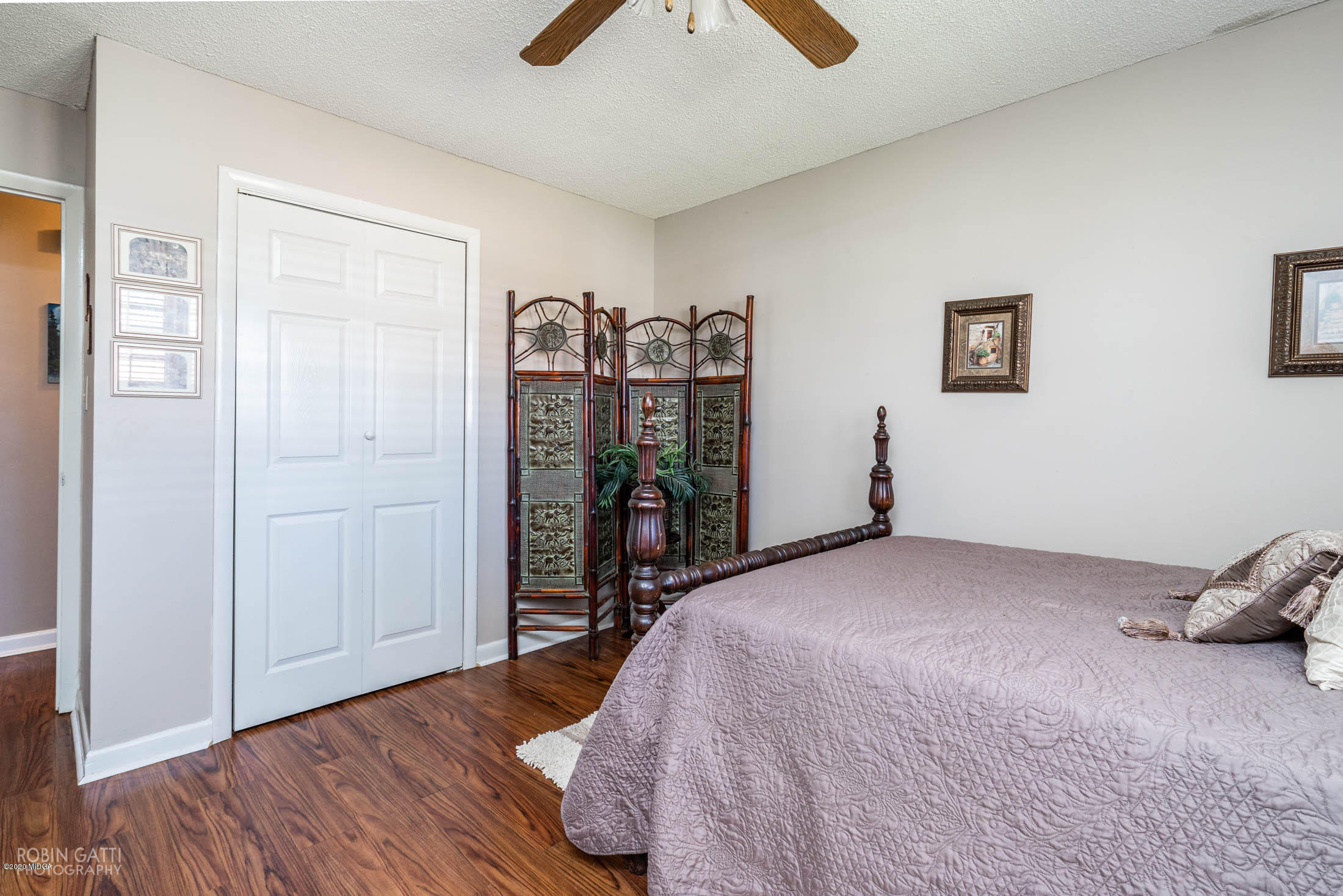 5720 School Road Macon, GA 31216 - Photo 24 of 31 a bed room with a bed and a walk in closet
