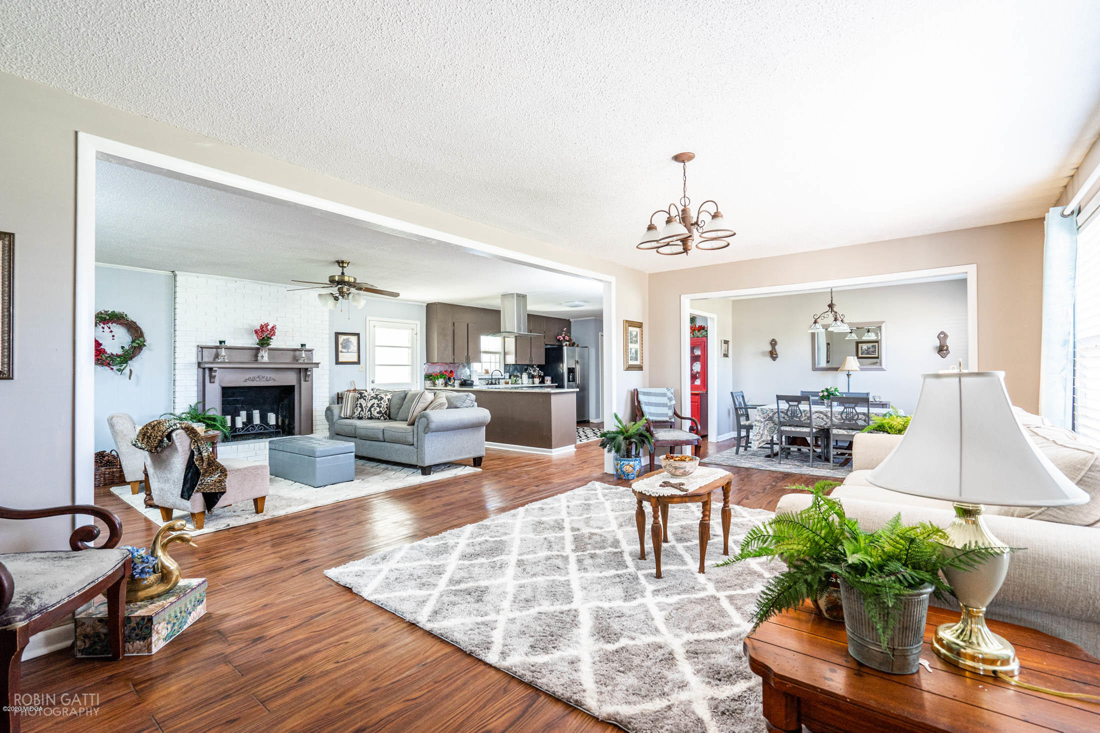 5720 School Road Macon, GA 31216 - Photo 5 of 31 a living room with furniture and a chandelier