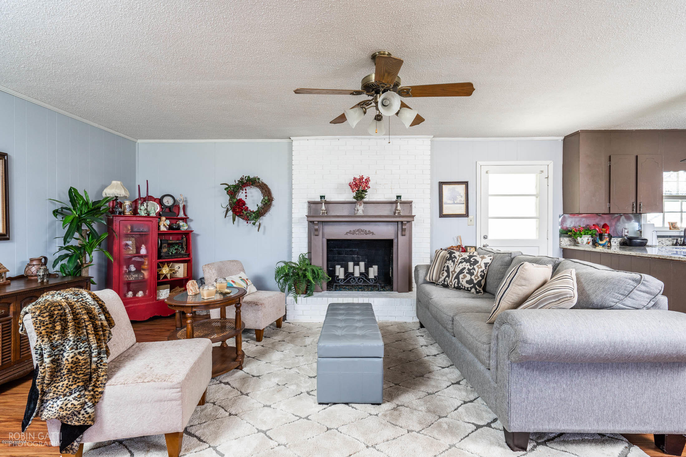 5720 School Road Macon, GA 31216 - Photo 6 of 31 a living room with furniture and a fireplace