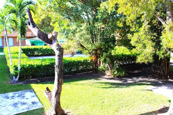 a view of a swimming pool with a yard