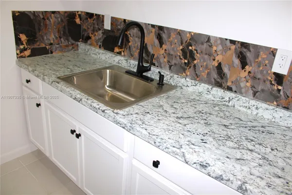 a kitchen with a stove and cabinets