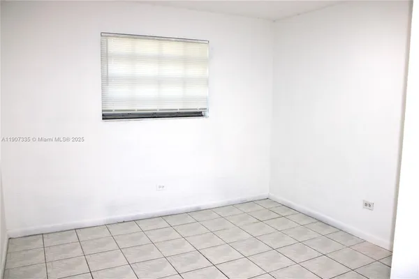 a picture of a bathroom with a shower